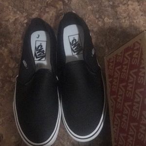 Black perforated leatherette vans.